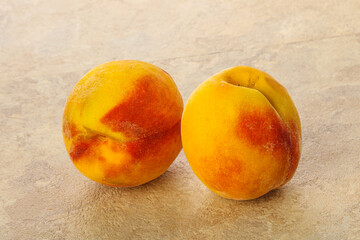 Two Sweet ripe tasty peaches