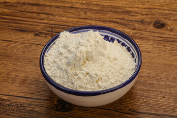 Wheat flour heap in the bowl