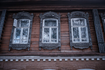 windows in an old wooden house, russian north architecture design