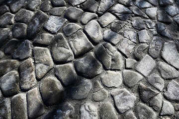 old stone pavement background / abstract pavement, large cobblestones, old road texture