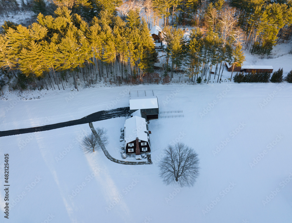 Poster aerial view of house after snow storm under sunlight