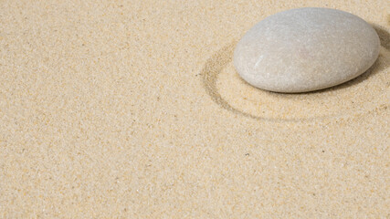 zen stones on sand
