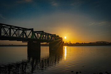 Fototapeta na wymiar Railway bridge at sunrise