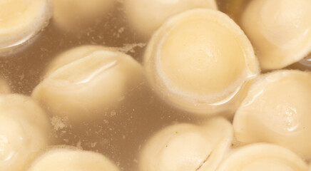 Dumplings made from dough and meat are boiled in boiled water.