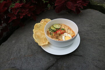 A bowl of Soto or Soup. Soto is a traditional soup consisting mainly of broth, meat and vegetables.