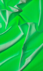 Green fabric material as an abstract background.