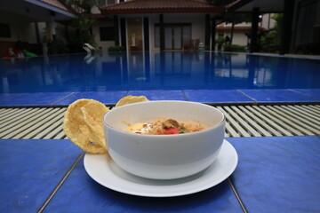 A bowl of Soto or Soup. Soto is a traditional soup consisting mainly of broth, meat and vegetables.