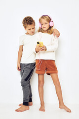 Young cheerful kid headphones with phone entertainment lifestyle childhood
