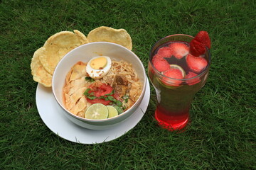 A bowl of Soto or Soup. Soto is a traditional soup consisting mainly of broth, meat and vegetables.