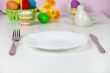 Easter table setting and dinner with festive decorations