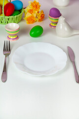 Easter table setting and dinner with festive decorations