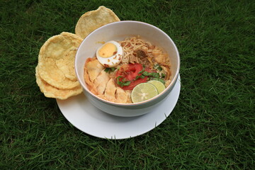 A bowl of Soto or Soup. Soto is a traditional soup consisting mainly of broth, meat and vegetables.