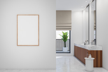 Bright bathroom interior with empty white poster, two mirrors
