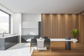 Bright kitchen interior with panoramic window with town view