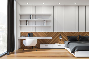 Light bedroom interior with bed, linens and workplace with window