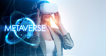 Businesswoman in formal suit is wearing and holding vr helmet