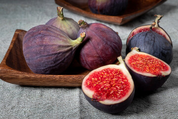 A few figs in a wooden plate
