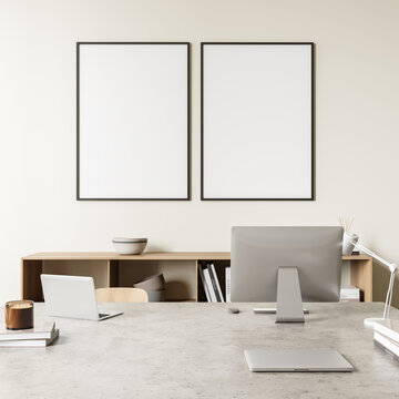 Bright office room interior with two empty white posters, desktop