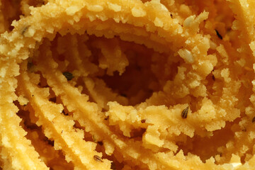 Murukku is a popular South Indian fried snack made with rice flour, lentil flours, spices and seasonings