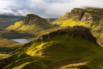 Beautiful morning light with dramatic clouds with a view towards Cleat, taken from The Quiraing on...
