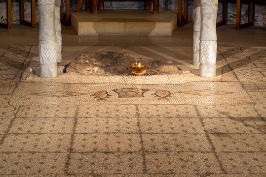 The alter and mosaic of the loaves and fishes at Tabgha or The Church of the Multiplication of the Loaves and Fishes also called Church of the Loaves and Fishes on the Sea of Galilee in Israel

