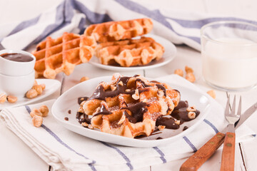 Waffles with chocolate cream and hazelnuts.