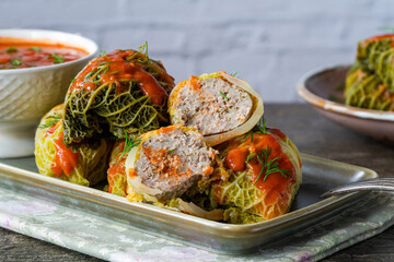 Gołabki - classic Polish dish of cabbage rolls stuffed with pork and rice in tomato sauce