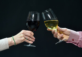  hands holding glasses of wine. luck. detail.