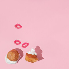 Valentines day creative layout with muffins and kiss prints on pastel pink background. 80s or 90s retro fashion aesthetic love and kiss concept. Minimal romantic idea.