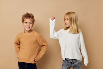 Boy and girl gesticulate with their hands together Lifestyle unaltered