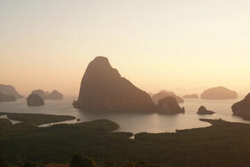 Landscape nature of Sunrise silhouette Samet Nangshe Viewpoint is the fantastic limestone formations on the bay   in Phang Nga Bay locate at Phang Nga Thailand - early morning