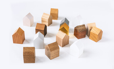 Group of similar wooden tiny toy houses. Wooden models of buildings as conceptual images for real...