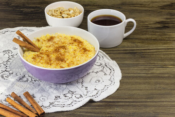 Corn cereal with peanuts and cinnamon in a purple bowl