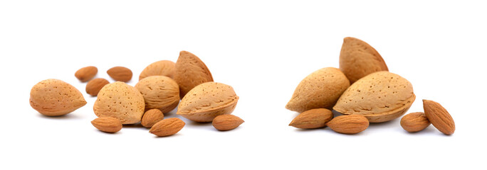 Heap of fresh almonds in shells isolated on white background