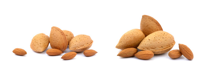 Heap of fresh almonds in shells isolated on white background
