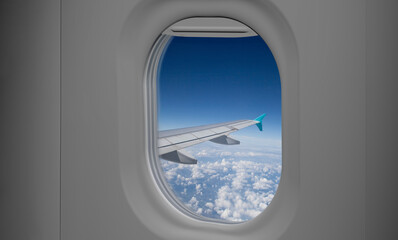 Aircraft window view from passenger seat on commercial  airplane