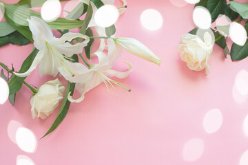 Fresh lilies on a pink background with a rose. Floral background.
