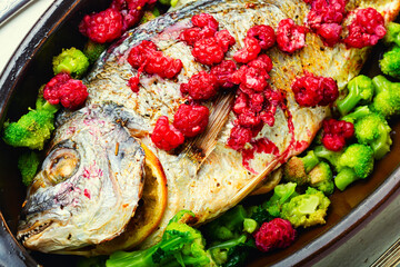Appetizing gilthead fish in berry sauce.