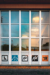 window in the building with sport figures and a light inside