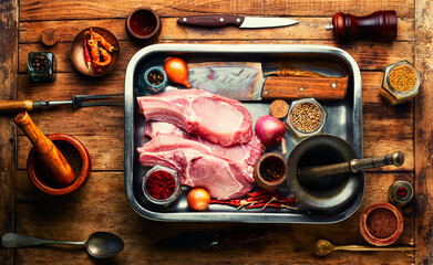 Obraz na płótnie Canvas Raw uncooked chop meat on the bone