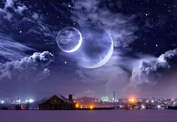 Winter landscape, a house on a hill, night city lights and a fantastic space with a double moon - 482150073