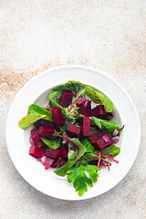 beetroot salad mix leaves green beet vegetable fresh dietary healthy meal food diet snack on the table copy space food background rustic top view keto or paleo diet veggie vegan or vegetarian food