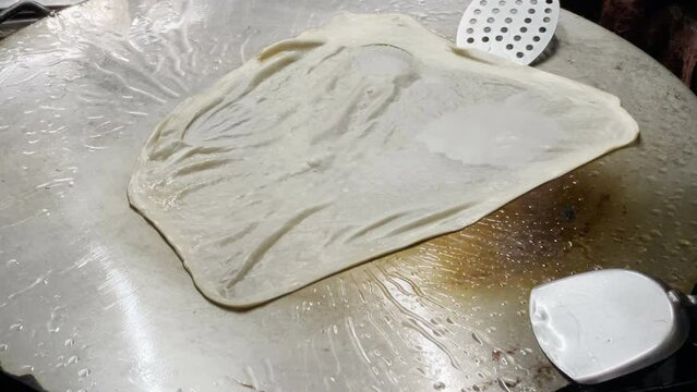 Make Mataba Roti with Flour and Eggs on a Hot Pan at Street Food in Thailand