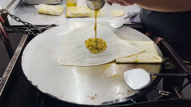 Make Mataba Roti with Flour and Eggs on a Hot Pan at Street Food in Thailand