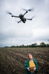 Fototapeta na wymiar Farmer with drone on a field. Smart farming and precision agriculture 