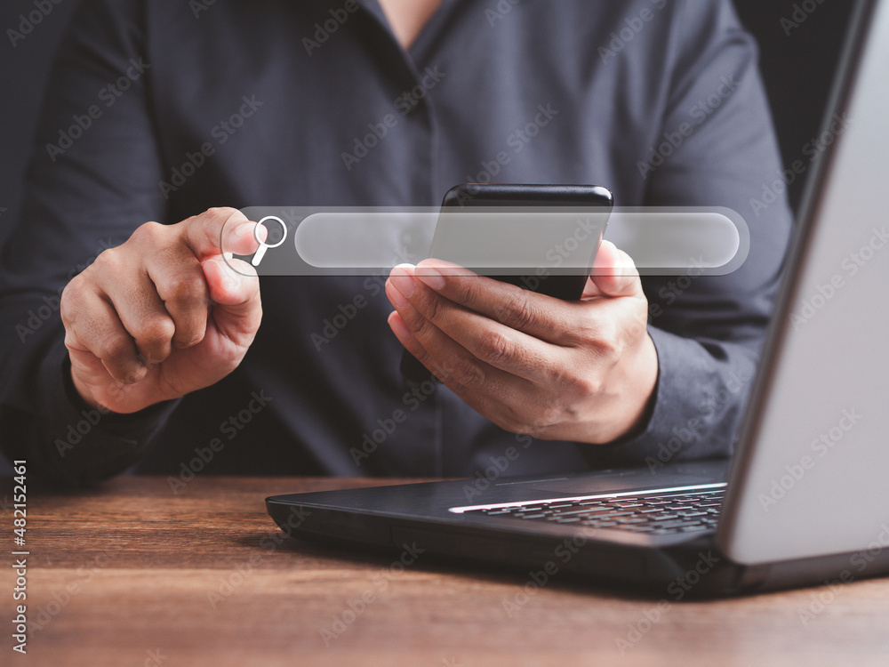 Poster search engine online concept. close-up of hand a man using a laptop for searching information on a w