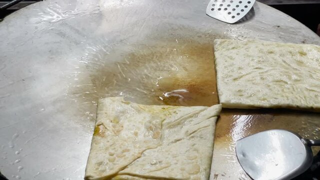 Make Mataba Roti with Flour and Eggs on a Hot Pan at Street Food in Thailand