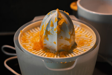 an electric orange squeezer. orange pulp