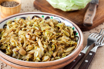 Fried white cabbage with caraway seeds and curry powder
