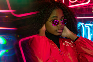 girl with sunglasses and fringe looking at camara 